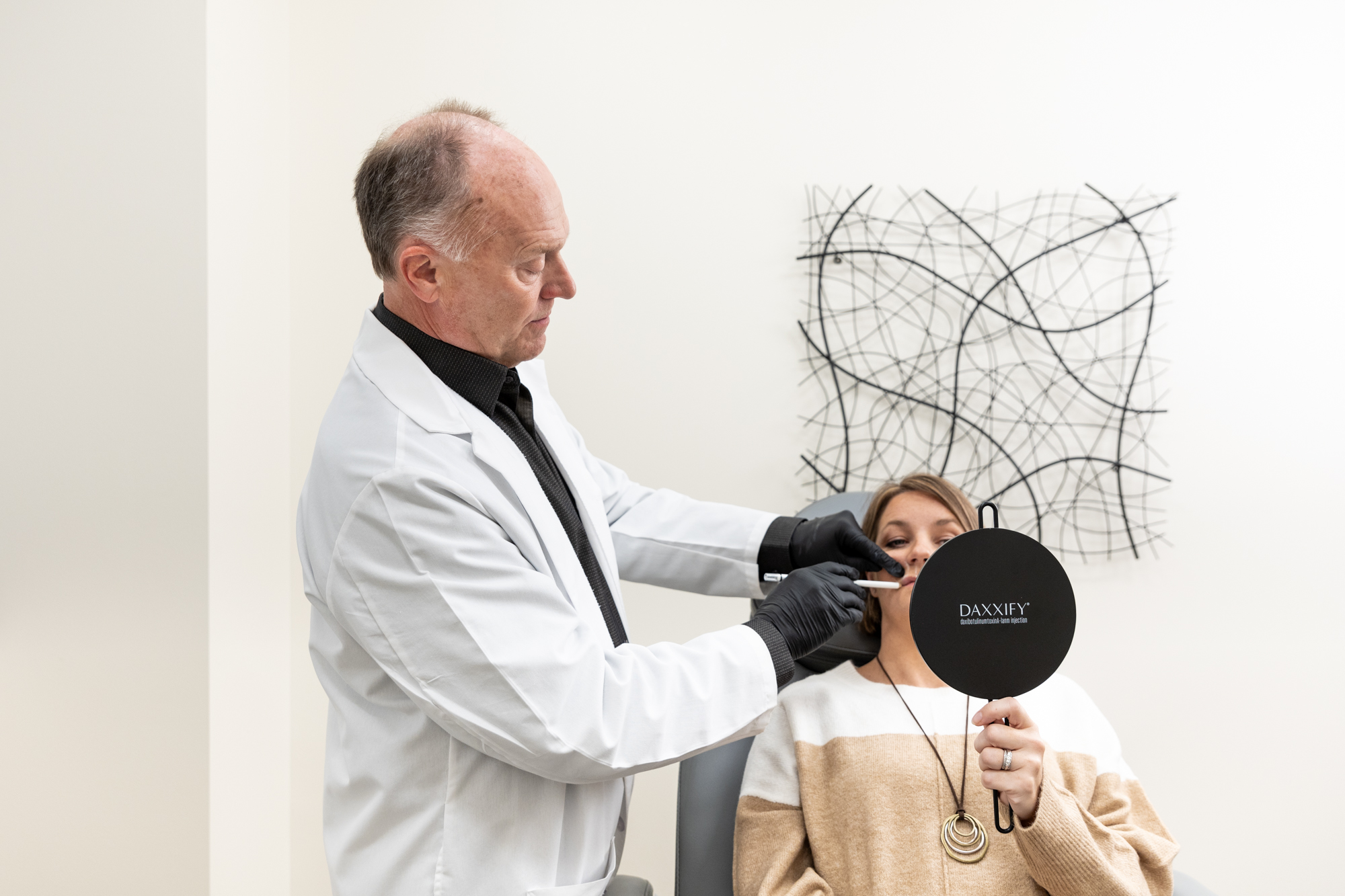 A provider at Enrichment Skin Solutions performs a complete facial analysis on a patient in preparation for her Botox and fillers near Plymouth injections. Tailoring a treatment plan based on our client's unique facial symmetry is always an important step we take at Enrichment Skin Solutions to ensure the best results possible.